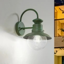 Aplique de exterior Lindby Celinor, verde, acero, Ø 15 cm