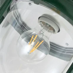 Aplique de exterior Lindby Clint, verde, luz hacia abajo, IP44