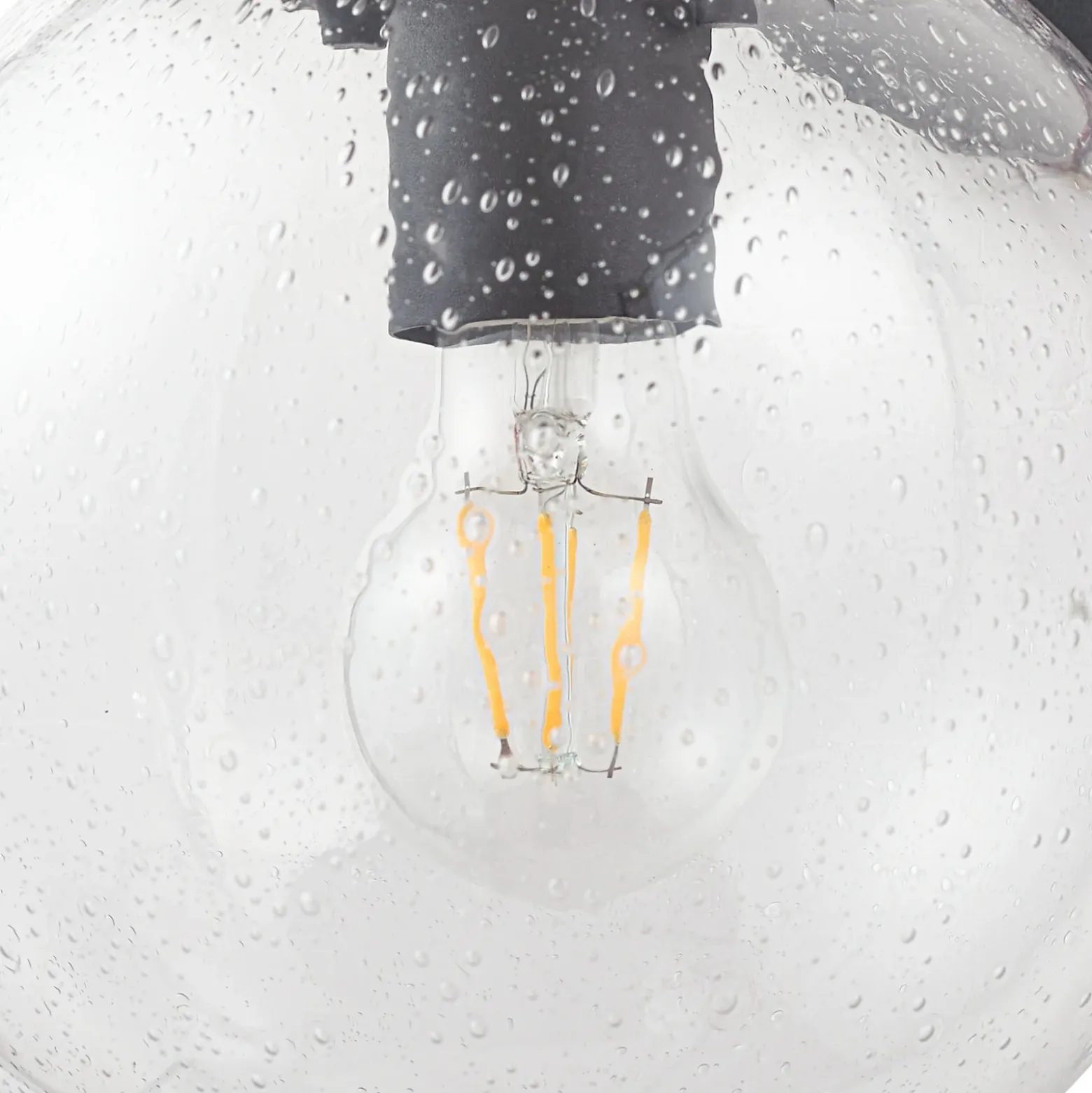 Aplique de exterior Lindby Dangan, negro/transparente, cristal, Ø 20 cm