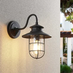 Aplique de exterior Lindby Kyan, altura 32 cm, negro, IP44, E27