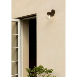 Aplique de exterior Nuura Liila, ancho 16 cm, bronce/transparente