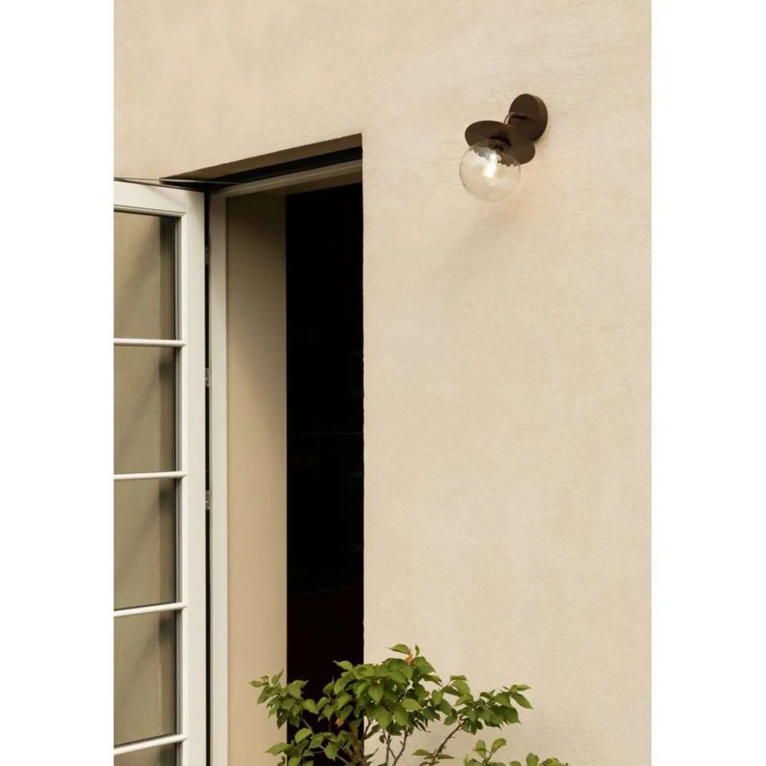 Aplique de exterior Nuura Liila, ancho 16 cm, bronce/transparente