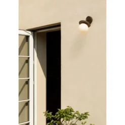 Aplique de exterior Nuura Liila, ancho 16 cm, bronce/ópalo