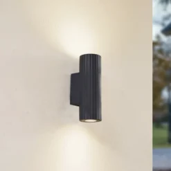 Aplique de pared Christa de Lindby, antracita, hormigón, 25 cm, estriado