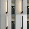 Aplique de pared LED Lindby Neano, 80 cm, negro, metal, IP54