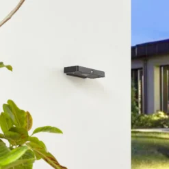 Aplique de pared LED solar Lucande Tavon, angular, negra, con sensor