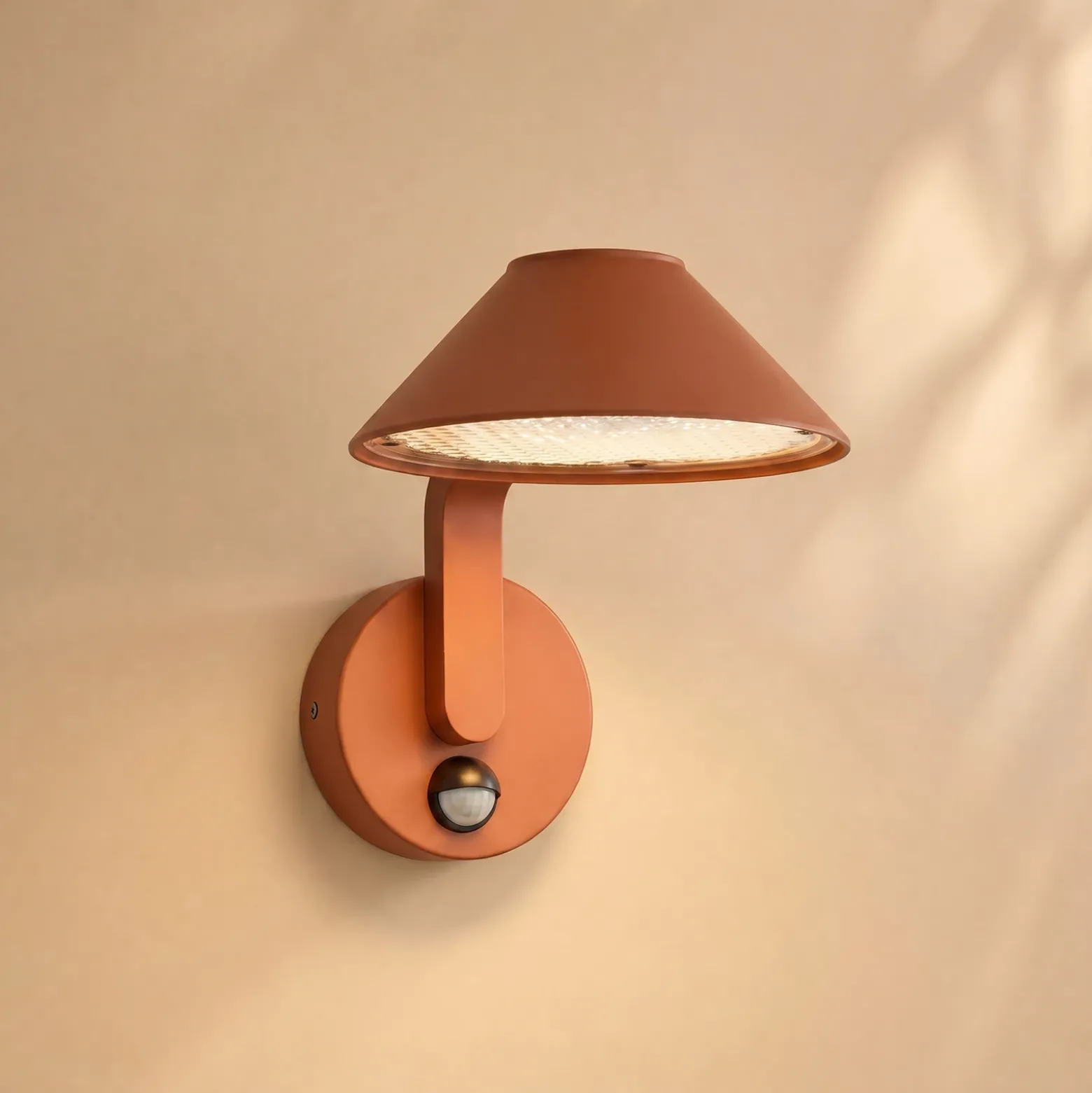 Aplique LED para exterior Lindby Capelo, color tierra, Ø 20 cm, con sensor