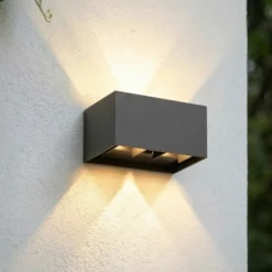 Aplique LED para exterior Lindby Nivar, angular, negro, 20 cm, IP54