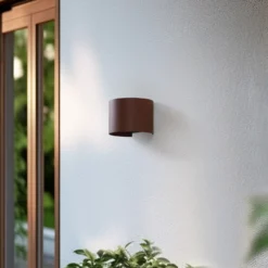 Aplique LED para exterior Lindby Smart Dara, redonda, color óxido, CCT RGB, Tuya