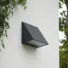 Aplique LED para exterior Lindby Triava, negro, aluminio, IP65