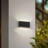Aplique LED para exterior Lindby Jarte, negra, metal, 17 cm, IP54