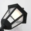 Aplique LED para exterior Lindby Iavo, sensor, negro, farol