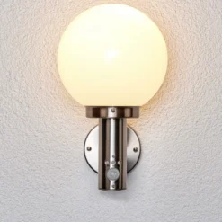 Aplique para exterior Lindby «Nada», acero inoxidable, cristal, sensor, E27