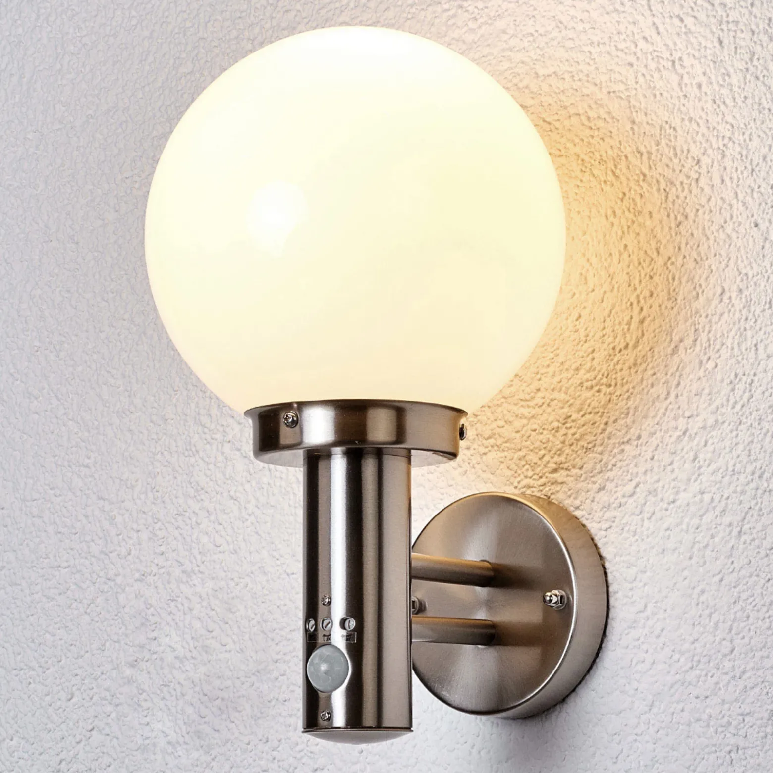 Aplique para exterior Lindby «Nada», acero inoxidable, cristal, sensor, E27