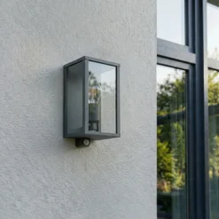 Aplique para exterior Lindby Peldar, antracita/transparente, 26 cm, sensor