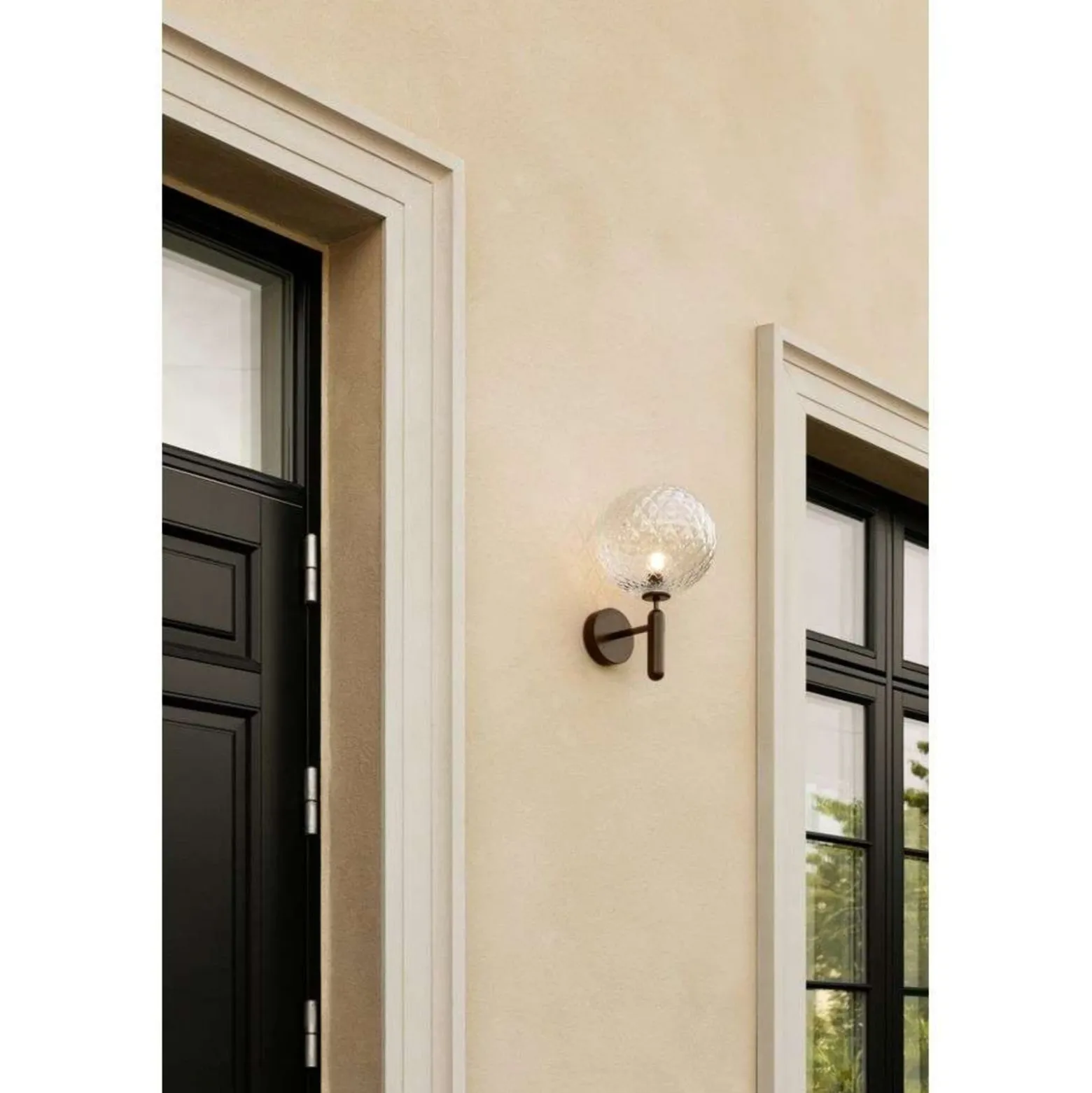 Aplique para exterior Nuura Miira, Ø 20 cm, bronce oscuro/transparente