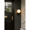 Aplique para exterior Nuura Miira, Ø 20 cm, negro/ópalo