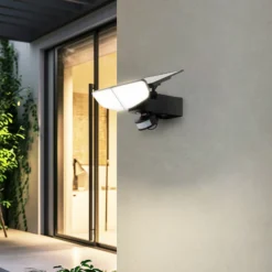 Aplique solar LED Lindby Naelin, negro, sensor, IP44