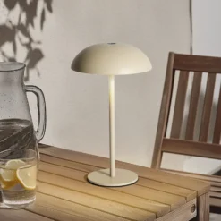 Arcchio LED lámpara de mesa recargable Thenra, beige, soporte de pared