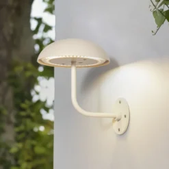 Arcchio LED lámpara de mesa recargable Thenra, beige, soporte de pared