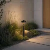 Bolardo luminoso LED Lucande Nirella, 60 cm, negro, CCT, con sensor