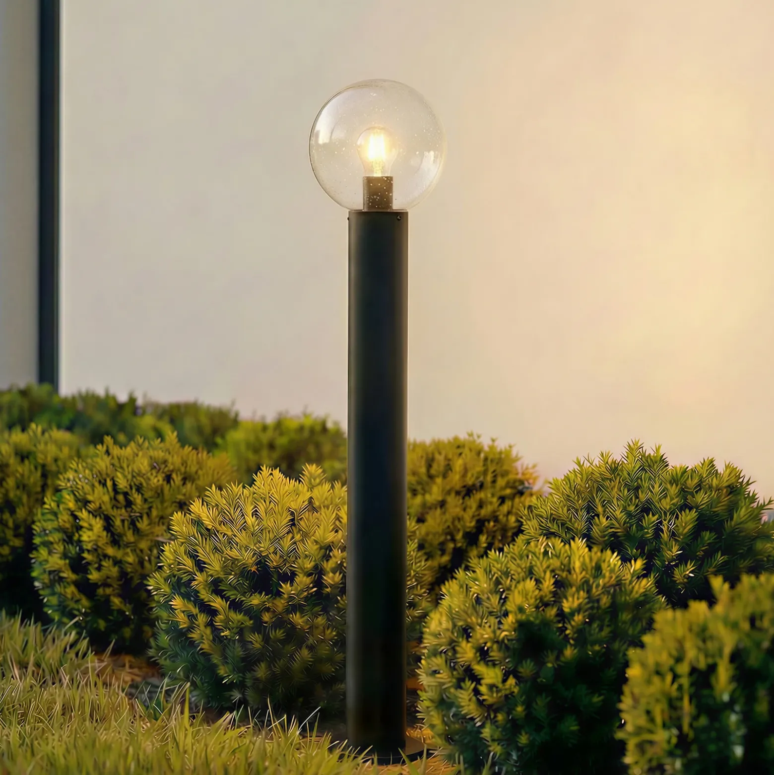 Bolardo luminoso Lindby Dangan, negro/transparente, altura 90 cm, cristal