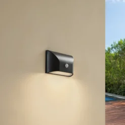 Lindby aplique LED para exterior Siana, negro, PC, sensor