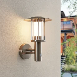 Lindby Aplique LED para exterior Gregory, sensor, acero inoxidable, IP44