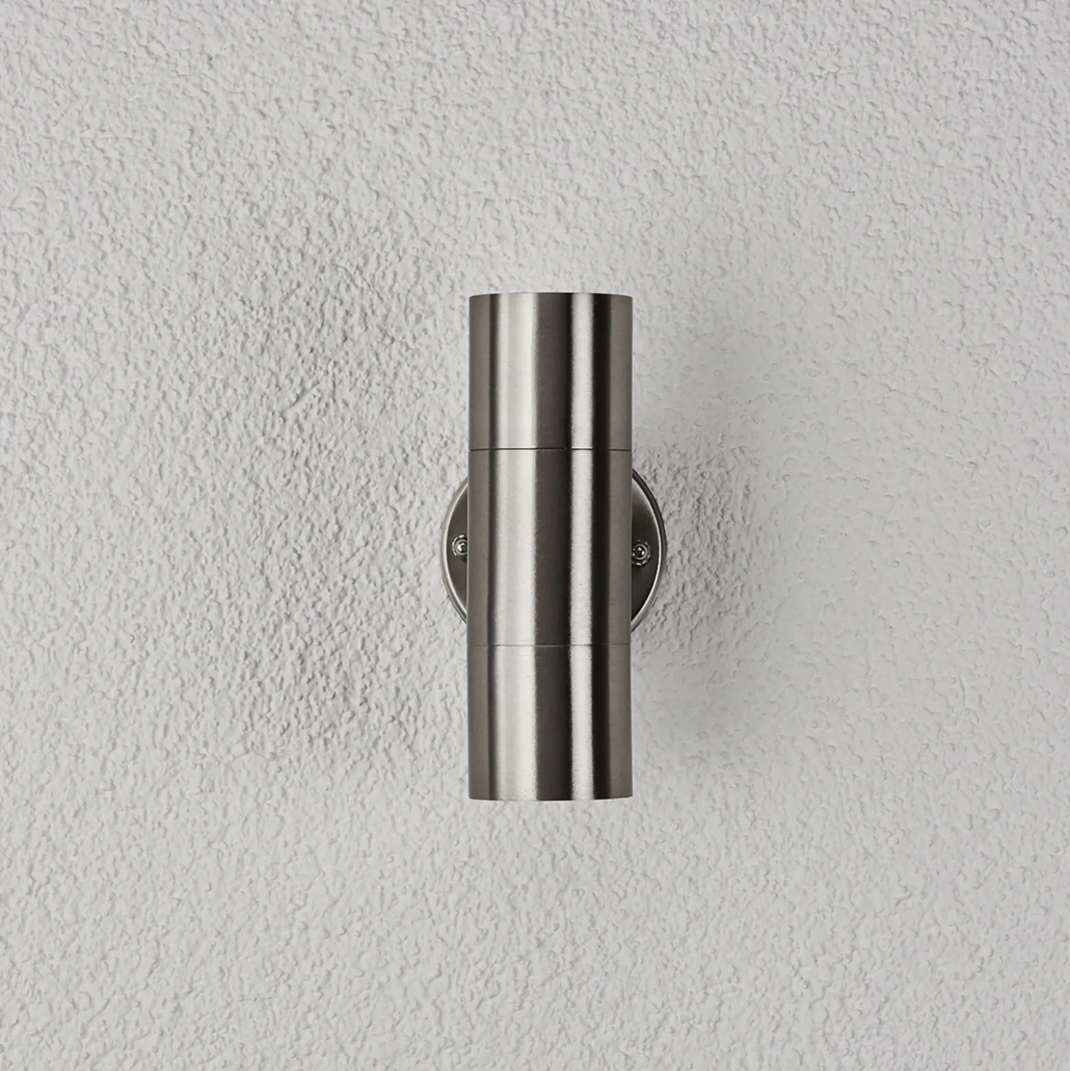 Lindby Aplique para exterior Hakan, arriba/abajo, acero inoxidable, IP44, GU10