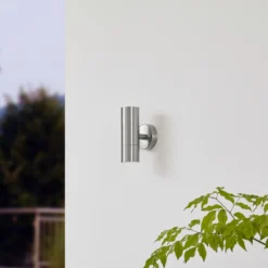 Lindby Aplique para exterior Hakan, arriba/abajo, acero inoxidable, IP44, GU10