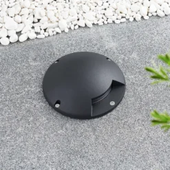 Lindby foco LED de suelo Cormac, 1 luz, Ø 21 cm, IP67