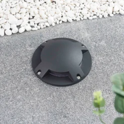Lindby foco LED de suelo Cormac, 4 luces, Ø 21 cm, IP67