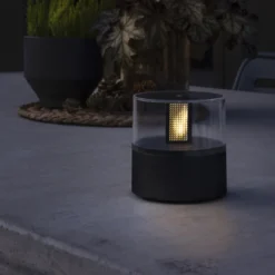 Lámpara decorativa con efecto llama, base negra