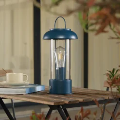 Lámpara de mesa LED recargable Lindby Yvette, azul, IP44, regulador táctil