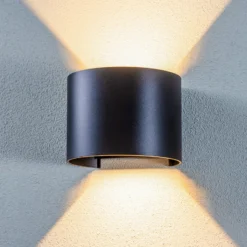 Lámpara de pared LED para exteriores Nivar de Lindby, redonda, negra, IP54