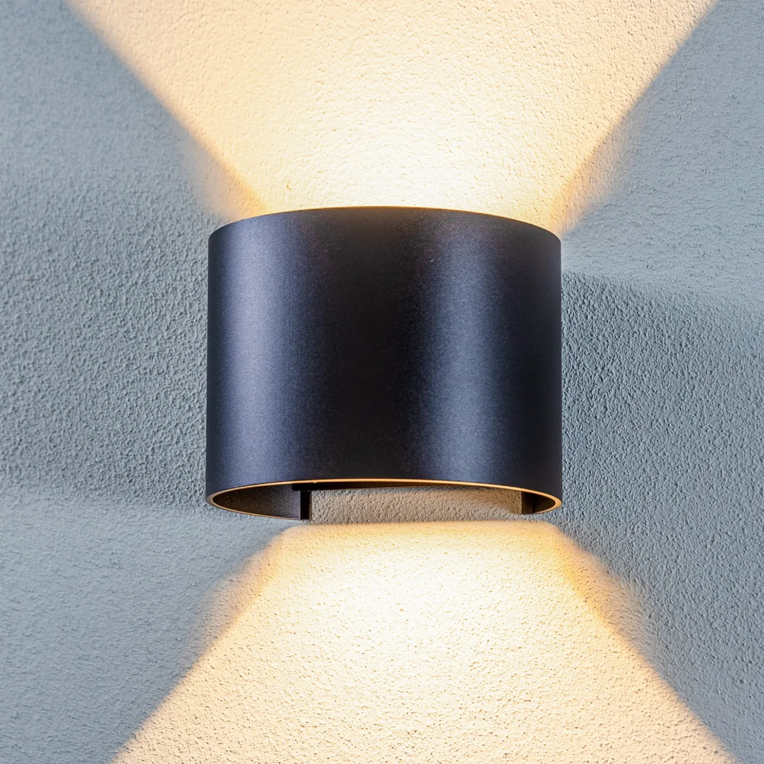 Lámpara de pared LED para exteriores Nivar de Lindby, redonda, negra, IP54