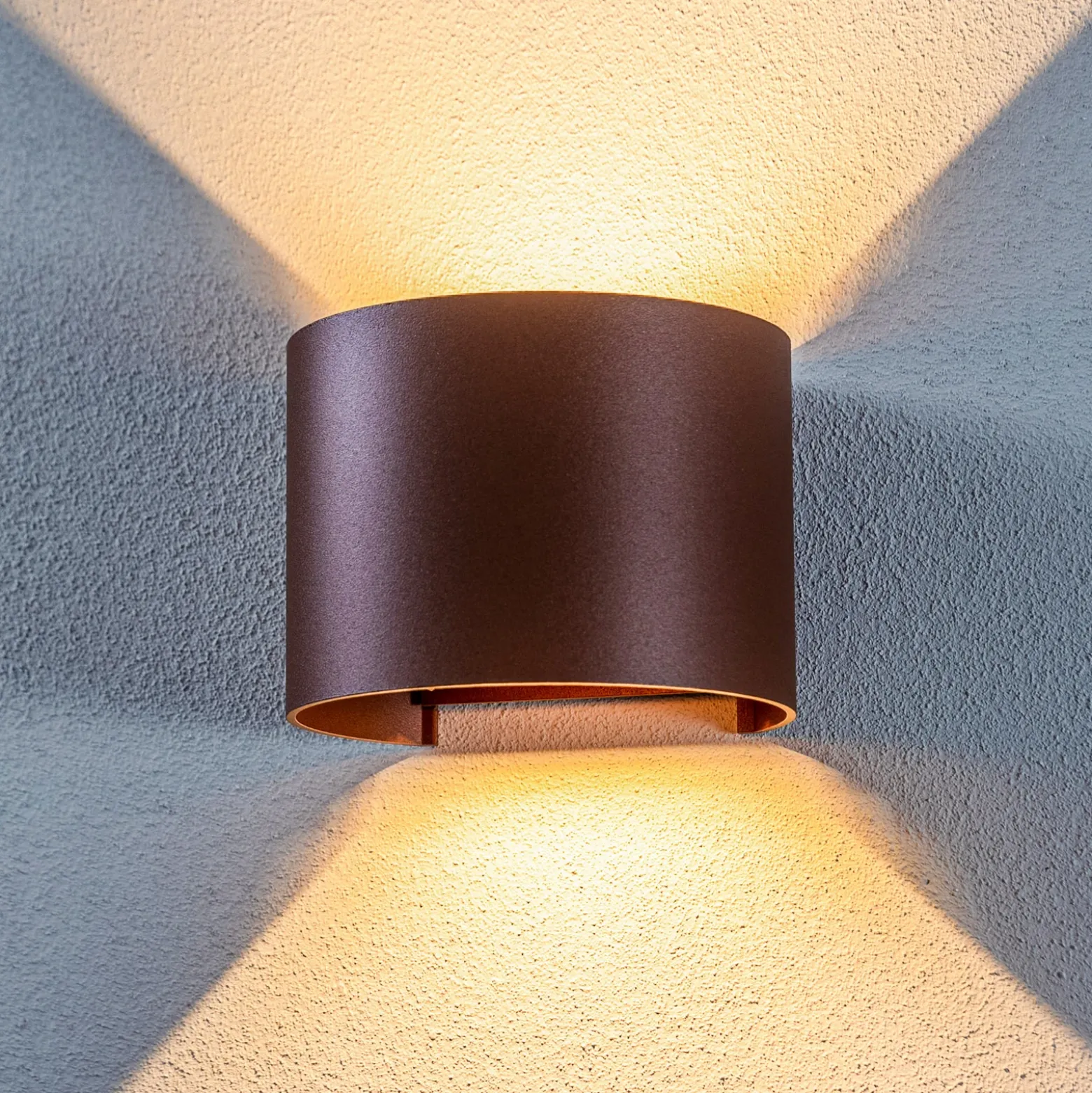 Lámpara de pared LED para exteriores Nivar de Lindby, redonda, óxido, metal,