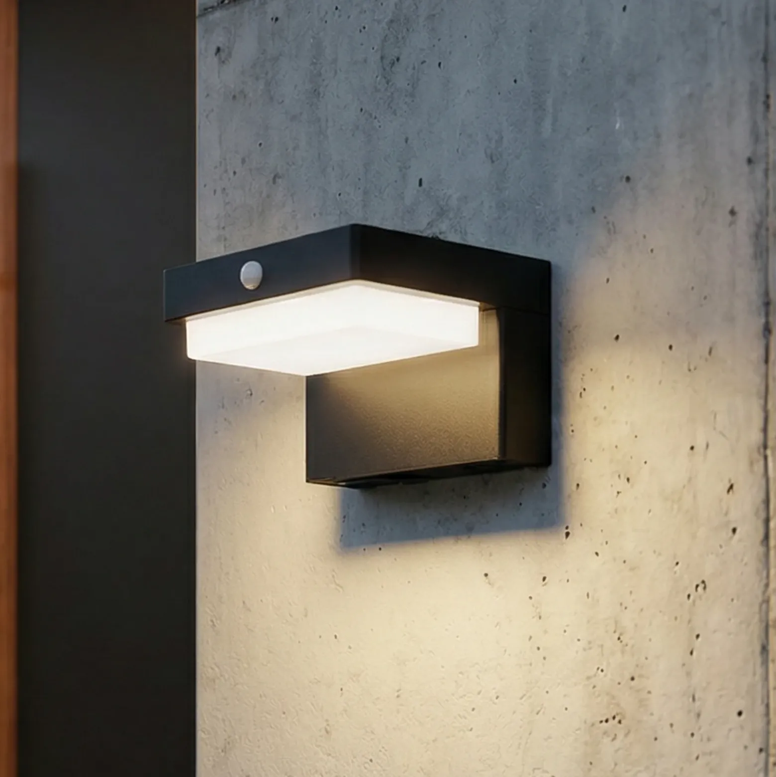 Lámpara de pared solar LED Eleazar de Lindby, negra, con sensor, atenuable