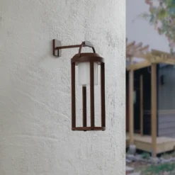 Lucande 2 en 1 Lámpara solar LED de pared Tilena, óxido, redonda, aluminio